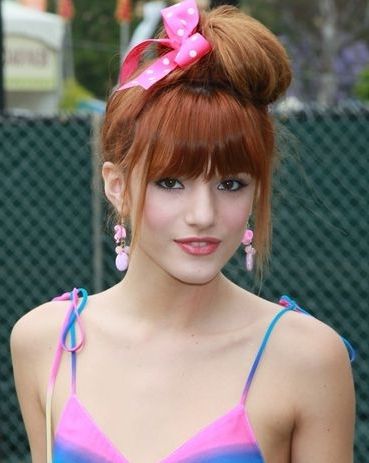 High Bun With Bow, Pieces Beside Bangs Pulled Down | 80s Hair + Pertaining To Most Up To Date 80s Hair Updo Hairstyles (View 14 of 15)