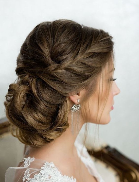 Side French Braid Low Wavy Bun Wedding Hairstyle | New Looks Within Current Low Side French Braid Hairstyles (Photo 1 of 15)