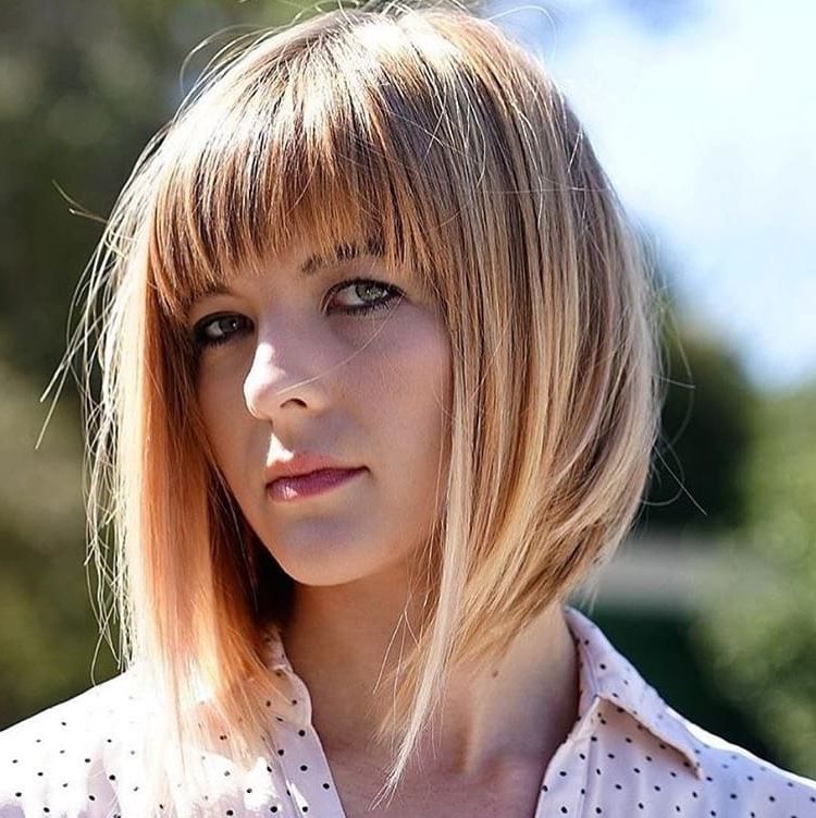 Women's Long A Line Bob With Brow Skimming Fringe Bangs And Throughout Shoulder Grazing Strawberry Shag Blonde Hairstyles (View 15 of 25)