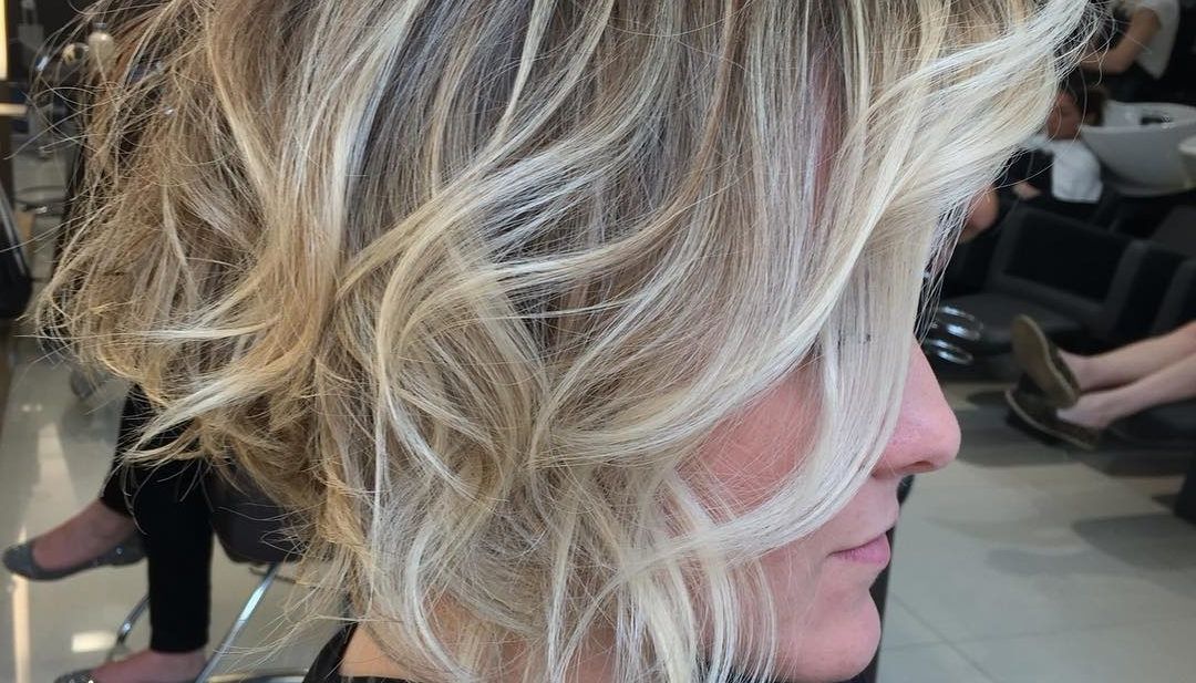 Women's Short Stacked Bob With Messy Voluminous Waves And Balayage Within Voluminous Stacked Cut Blonde Hairstyles (View 16 of 25)