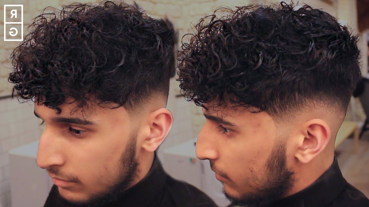Low Skin Fade Curly Haircut For Men With Disconnected Undercut Intended For Undercut Hairstyles For Curly Hair (View 17 of 25)