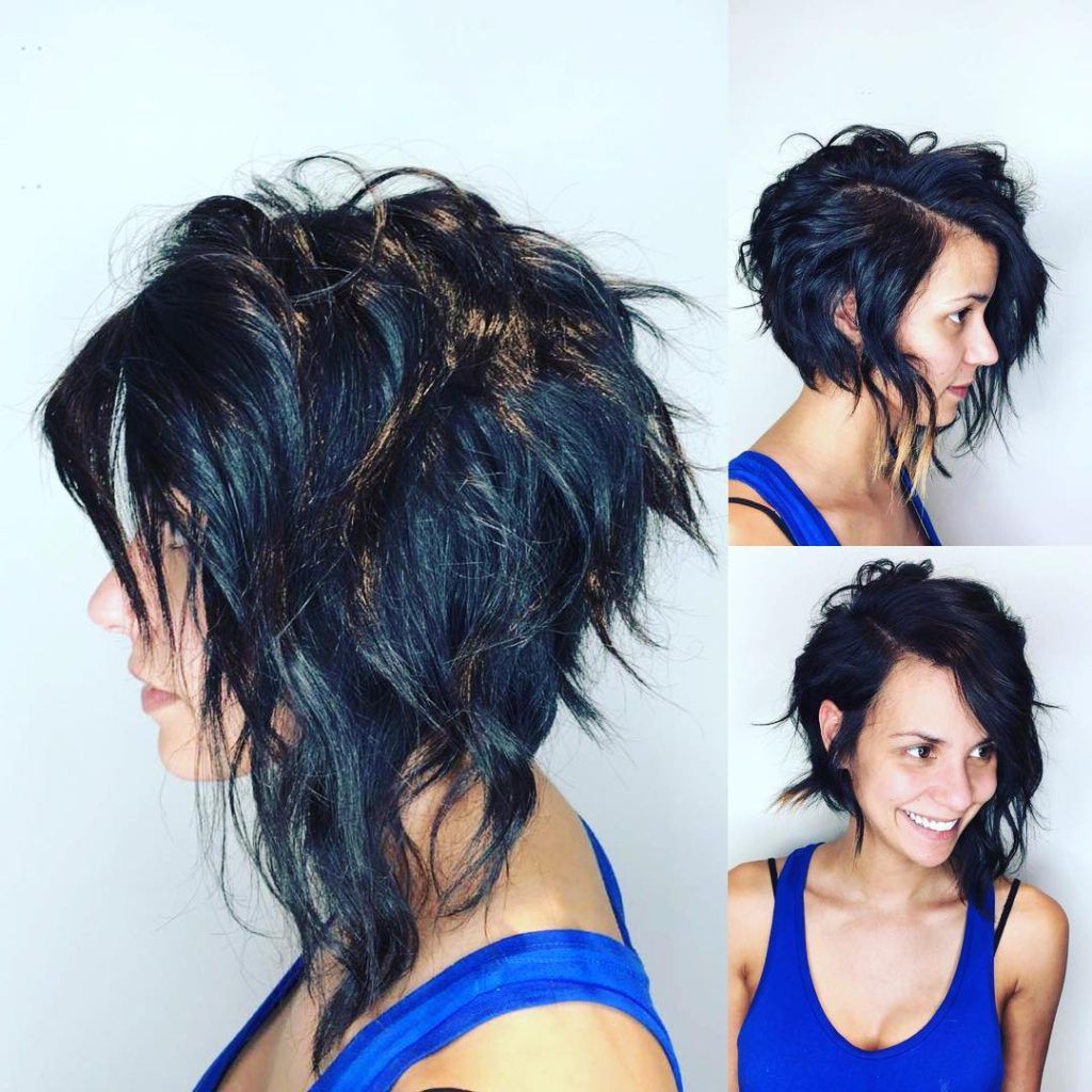 Women's Edgy Angled Asymmetric Razor Cut Bob With Wavy Texture And Throughout Black Wet Curly Bob Hairstyles With Subtle Highlights (View 17 of 25)