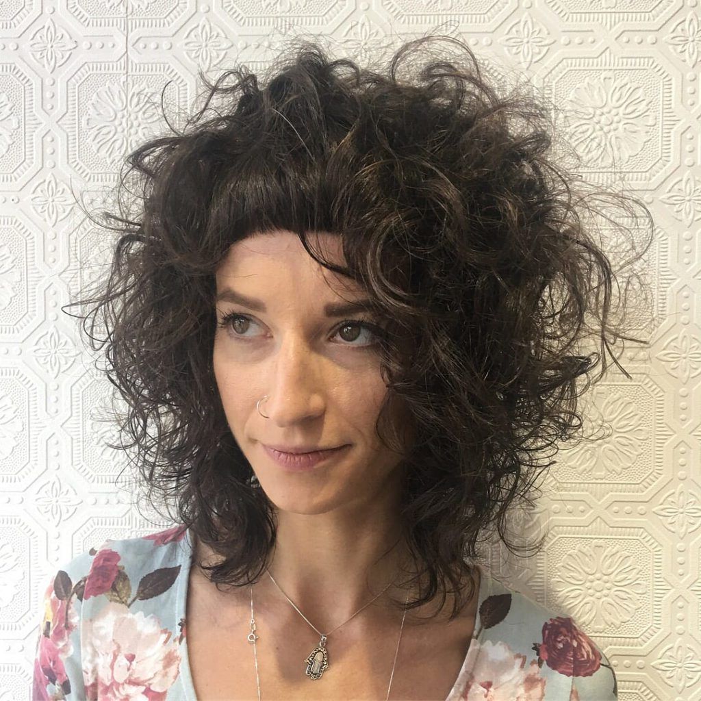 Women's Messy Textured Curly Bob With Micro Bangs On Brunette Hair Intended For Curly Brunette Bob Hairstyles With Bangs (Photo 5 of 25)