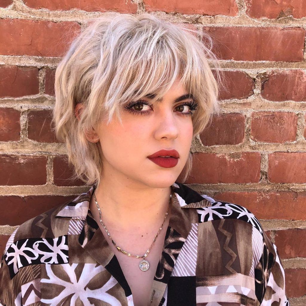 Women's Platinum Short Shaggy Bob With Messy Wavy Texture And Fringe Within Wavy Messy Pixie Hairstyles With Bangs (View 17 of 25)