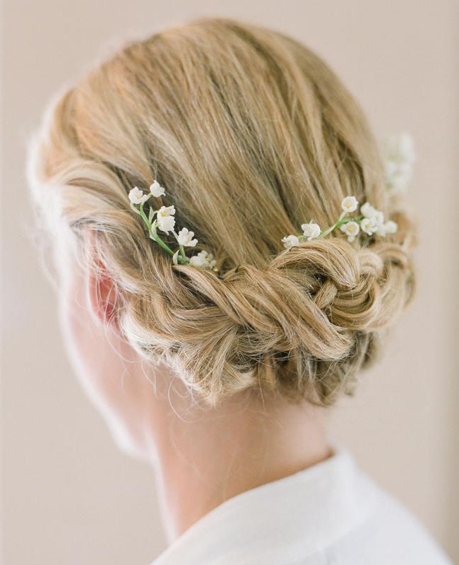 30 Elegant And Graceful Wedding Hairstyles With Flowers – Haircuts Inside Undone Low Bun Bridal Hairstyles With Floral Headband (View 15 of 25)
