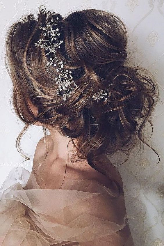 41 Trendy And Chic Messy Wedding Hairstyles – Weddingomania In Undone Low Bun Bridal Hairstyles With Floral Headband (View 18 of 25)
