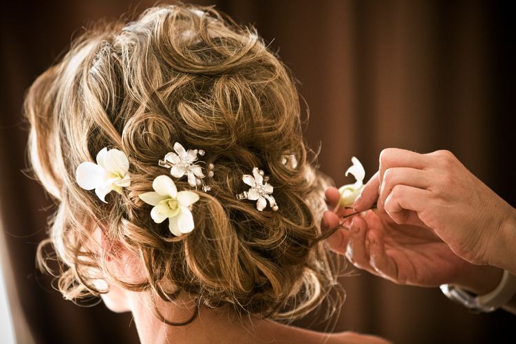 Bride Hairstyles: What Flowers Do You Choose? – Wedding Hair Style Regarding Curly Wedding Hairstyles With An Orchid (View 7 of 25)