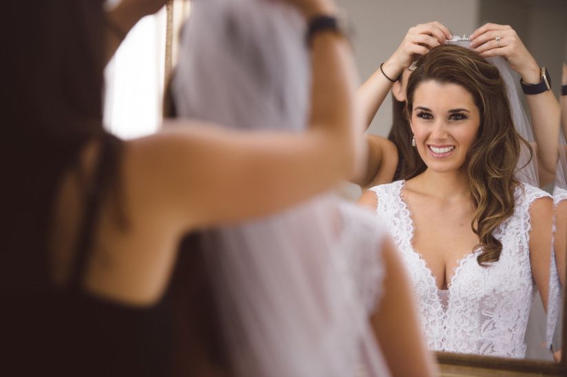 How To Wear A Veil With Every Wedding Hairstyle – Weddingwire Pertaining To Curly Bridal Bun Hairstyles With Veil (View 19 of 25)