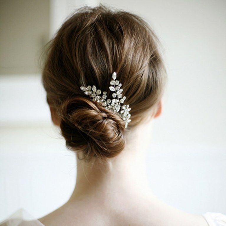 Wedding Hair Ideas: Fresh Twists On The Classic Bridal Bun | Brides Inside Chignon Wedding Hairstyles With Pinned Up Embellishment (View 3 of 25)