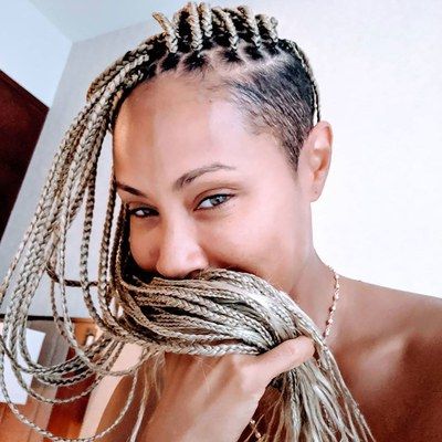 21 Dope Box Braids Hairstyles To Try | Allure In Best And Newest Half Up Buns Yarn Braid Hairstyles (View 22 of 25)