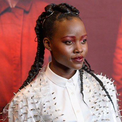 Lupita Nyong'o: Best Beauty Looks | Allure Within Most Current Halo Braided Hairstyles With Long Tendrils (View 16 of 25)
