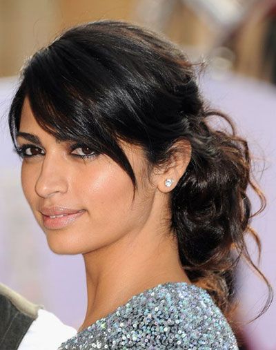 Camila Alves' Disheveled Curly Bun With Low Side Bangs With Regard To Sexy Low Bun Hairstyles With Side Sweep (View 6 of 25)
