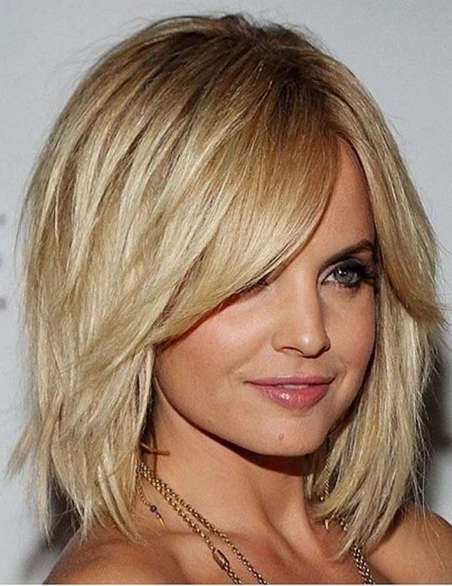 20 Medium Layered Haircuts Regarding Layered Haircuts With Delicate Feathers (Photo 6 of 25)