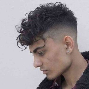 Curly Undercut: 30 Modern Curly Haircuts For Men Intended For 2018 Contrasting Undercuts With Textured Coif (View 14 of 25)