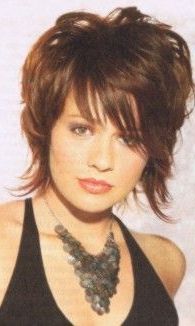 A Brunette With Progressive Layers Hairstyle With Wispy For Short Wavy Hairstyles With Straight Wispy Fringe (View 14 of 25)
