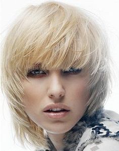 A Medium Blonde Straight Coloured Choppy Feathered Messy Regarding Shaggy Bob Hairstyles With Soft Blunt Bangs (View 16 of 25)