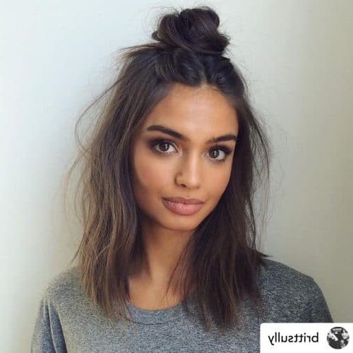 11 Ultra Sexy Medium Length Hairstyles (for Women Of All Ages In 2022) For Most Up To Date Medium Length Wavy Hairstyles With Top Knot (View 4 of 25)