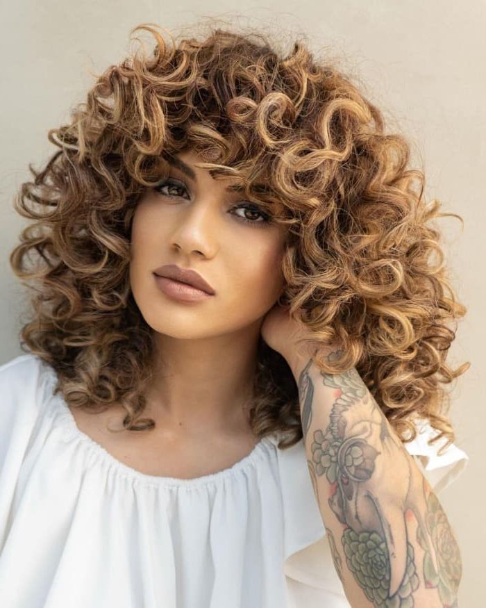 37 Trending Curly Hairstyles For Women To Try In 2022 For Most Recent Medium Length Curly Haircuts (View 9 of 25)