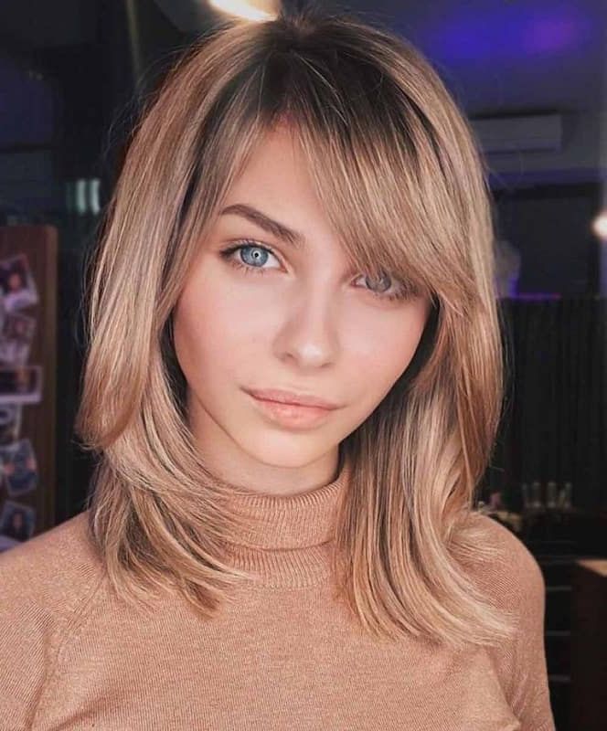 50 Effortless Long Bobs With Side Bangs For 2022 – Hairstyle Camp For Best And Newest Side Parted Angled Chocolate Lob Haircuts (View 13 of 25)