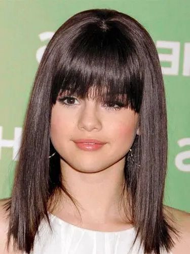 9 Easy Medium Length Hairstyles For Thick Hair To Try This Year Inside Most Popular Easy Medium Length Hairstyles For Thick Wavy Hair (View 20 of 25)