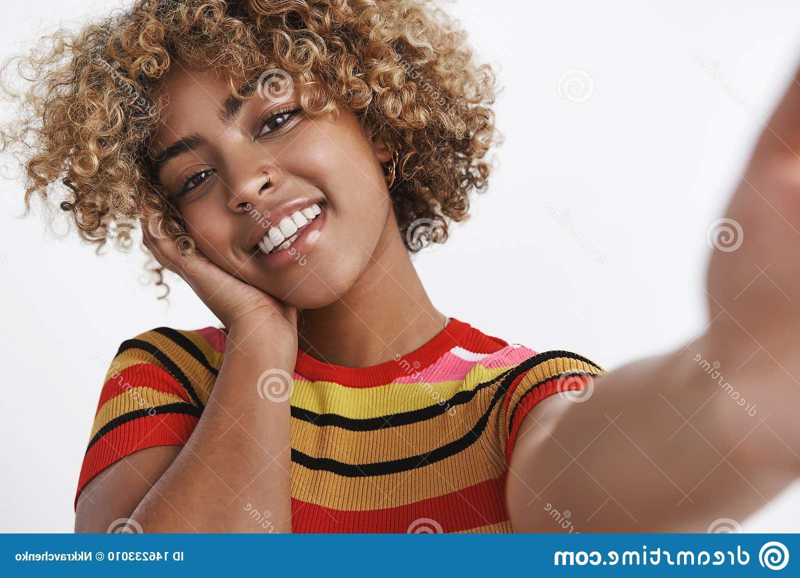 Selfie Shot Of Stylish African American Woman With Pierced Nose And Fair Curly  Haircut Tilting Head Carefree And Tender Stock Photo – Image Of  Advertisement, Person: 146233010 For Most Up To Date Carefree Curls Haircuts (View 12 of 25)