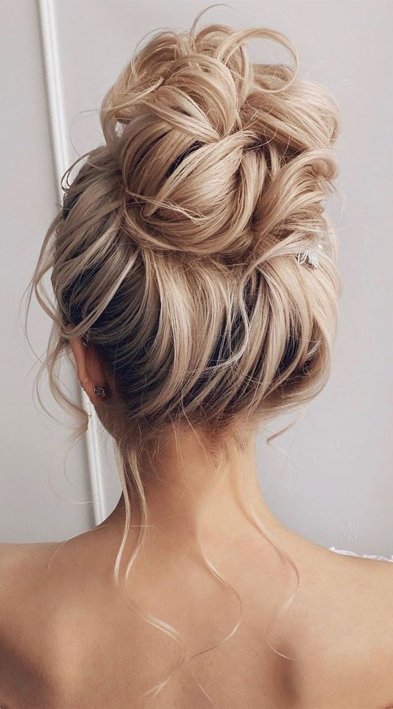 Updo Hairstyles For Your Stylish Looks In 2021 : Messy High Bun In 2018 Twisted Buns Hairstyles For Your Medium Hair (View 11 of 25)