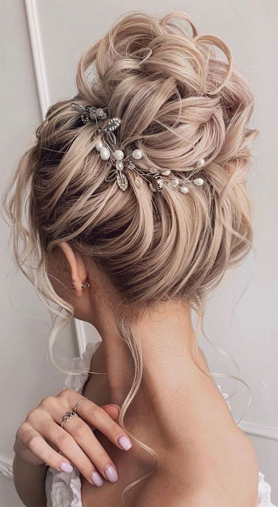Updo Hairstyles For Your Stylish Looks In 2021 : Textured High Bun Hairstyle With Most Up To Date High Bun Hairstyles (Photo 22 of 25)