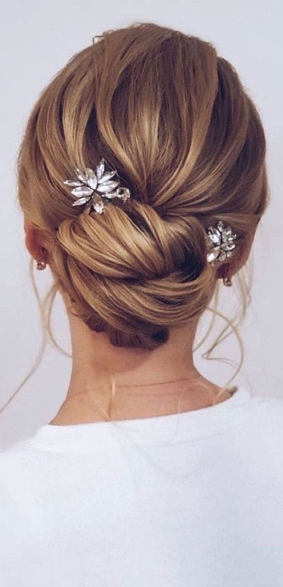 Updo Hairstyles For Your Stylish Looks In 2021 : Twisted Low Bun Regarding Most Recently Twisted Buns Hairstyles For Your Medium Hair (View 20 of 25)