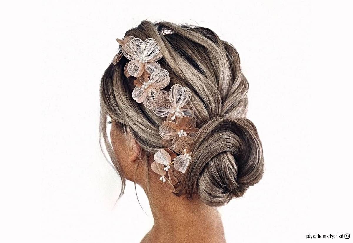 20 Romantic Bun Hairstyles For Prom That Are Easy To Do For Low Flower Bun For Long Hair (Photo 7 of 25)