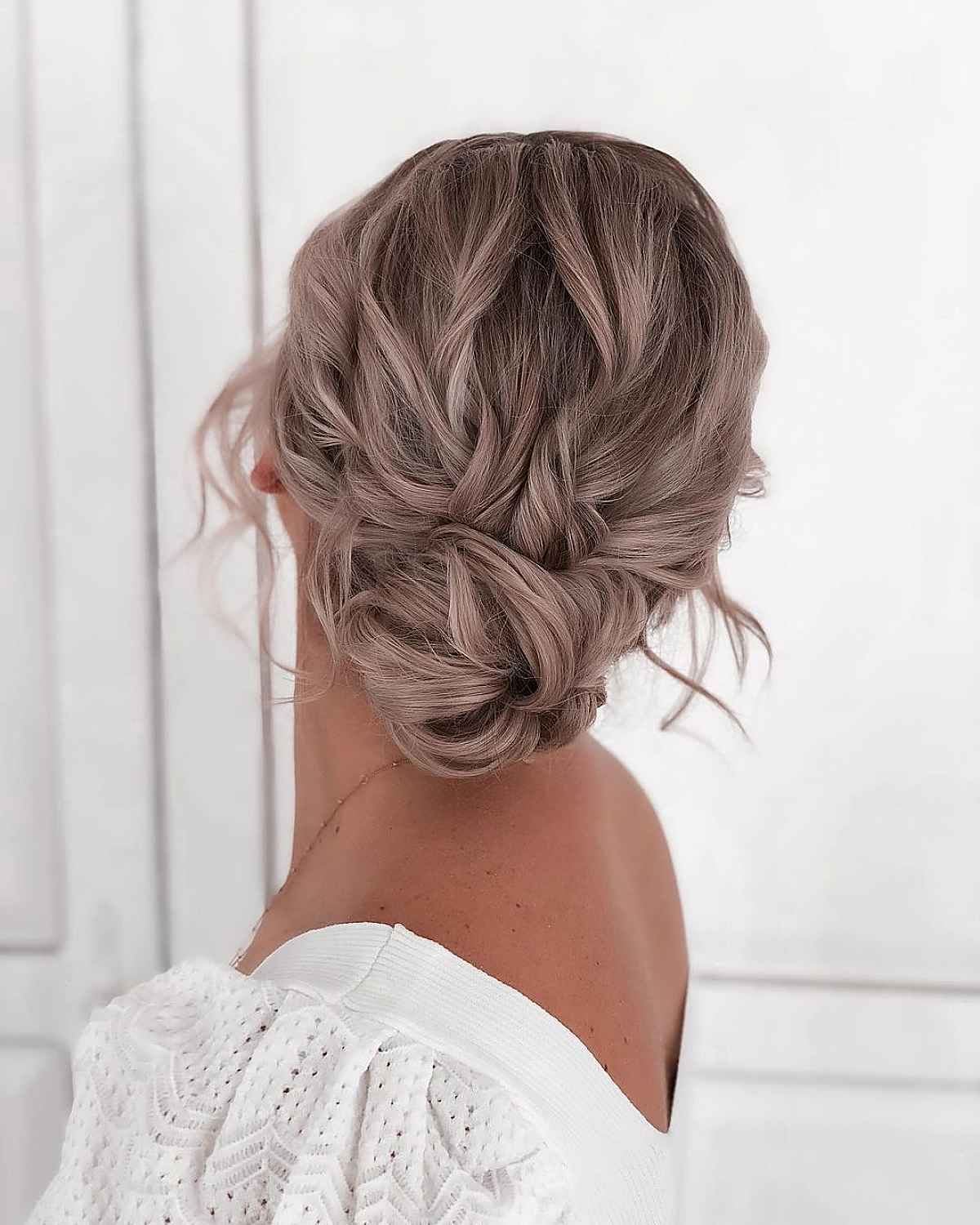 20 Romantic Bun Hairstyles For Prom That Are Easy To Do Throughout Low Formal Bun Updo (View 11 of 25)