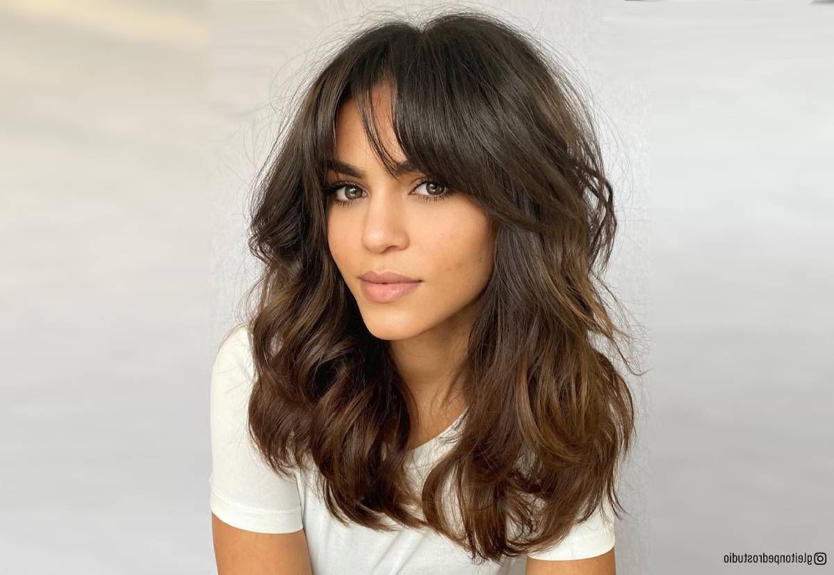 32 Ways To Pair Wavy Hair With Bangs For A Super Flattering Look Throughout Most Recently Thick Bottleneck Bangs (Photo 18 of 18)