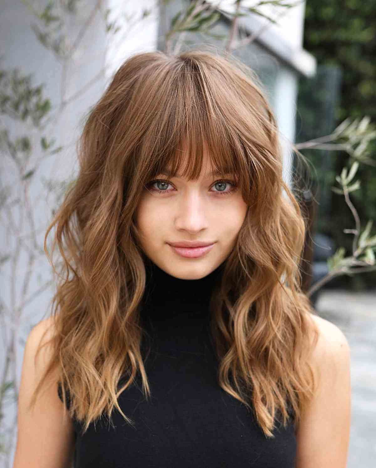 32 Ways To Pair Wavy Hair With Bangs For A Super Flattering Look With Current Dense Fringe Plus Messy Waves (Photo 5 of 18)