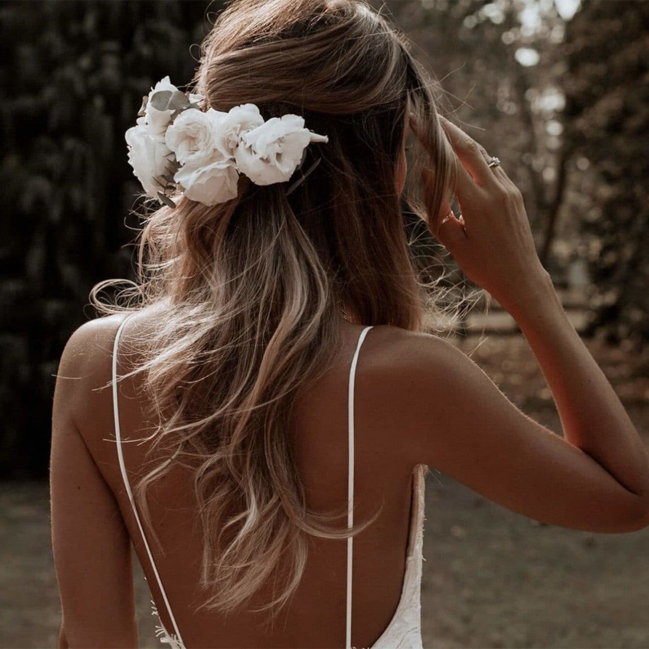 63 Wedding Hairstyles & Bridal Hair Ideas For 2023 | Glamour Uk In Low Flower Bun For Long Hair (View 13 of 25)