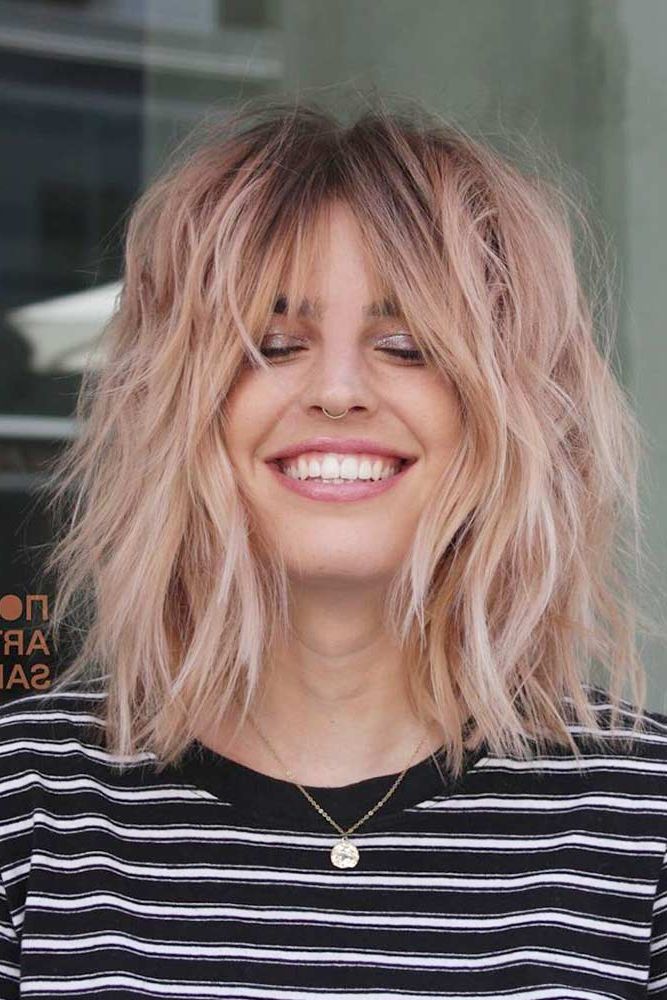 Layered Bob Haircuts & Why You Should Get One In 2023 Throughout Most Recent Blonde Razored Lob With Full Bangs (Photo 9 of 18)
