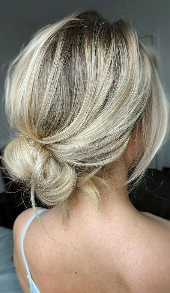 Sophisticated Updos For Any Occasion – Twisted Sleek Low Bun In Fancy Loose Low Updo (View 22 of 25)