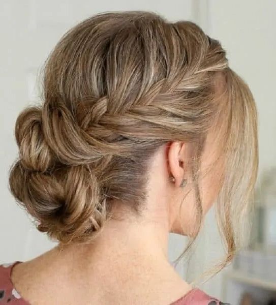 Top 17 Side Braided Bun Hairstyles To Try In 2023 Intended For Low Braided Bun With A Side Braid (View 11 of 25)