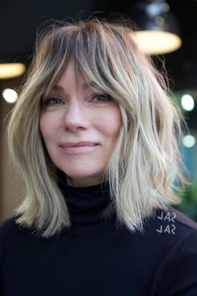 Upgrade Your Look: Medium Hairstyles With Bangs – Glaminati Throughout Current Mid Length Hair With Wispy Bangs (Photo 15 of 18)