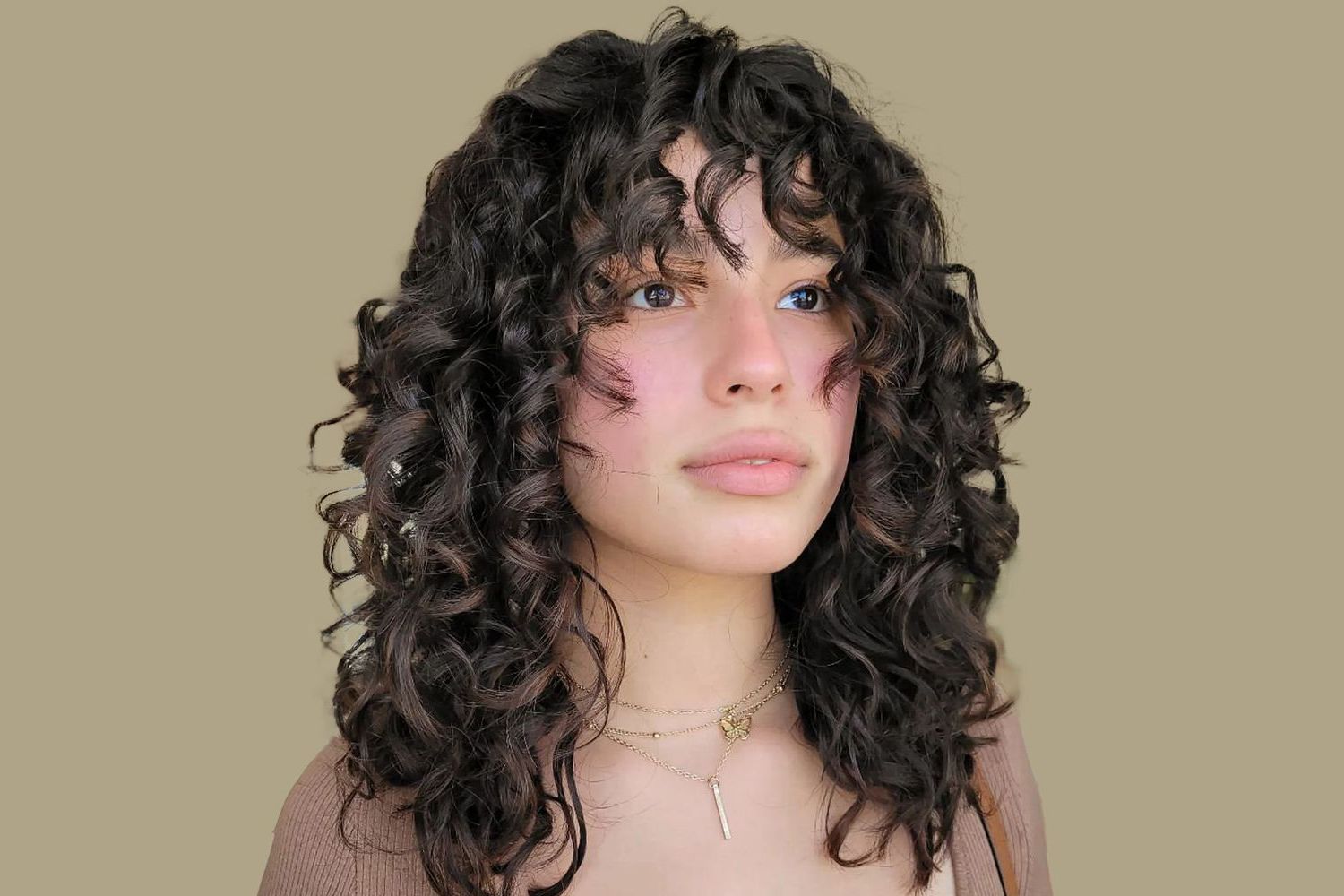 Your Complete Guide To Getting Bangs With Curly Hair With Regard To Most Recent Slightly Curly Hair With Bangs (Photo 4 of 18)