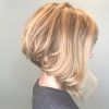 Angled Brunette Bob Hairstyles With Messy Curls (Photo 25 of 25)