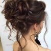 Large Bun Wedding Hairstyles With Messy Curls (Photo 12 of 25)