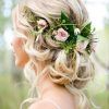 Undone Low Bun Bridal Hairstyles With Floral Headband (Photo 1 of 25)