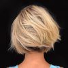 Dynamic Tousled Blonde Bob Hairstyles With Dark Underlayer (Photo 1 of 25)