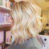 Curly Angled Blonde Bob Hairstyles (Photo 9 of 25)