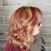 Medium Hairstyles With Perky Feathery Layers (Photo 21 of 25)