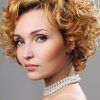 Curly Ash Blonde Updo Hairstyles With Bouffant And Bangs (Photo 14 of 25)
