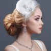 Large Curly Bun Bridal Hairstyles With Beaded Clip (Photo 14 of 25)