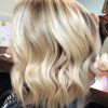 Soft Waves Blonde Hairstyles With Platinum Tips (Photo 17 of 25)