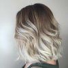 Angled Wavy Lob Blonde Hairstyles (Photo 21 of 25)