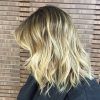 Tousled Shoulder Length Waves Blonde Hairstyles (Photo 18 of 25)