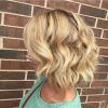Curly Angled Blonde Bob Hairstyles (Photo 22 of 25)